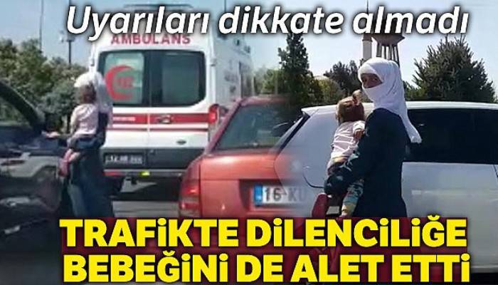 Trafikte dilenciliğe bebeğini de alet etti